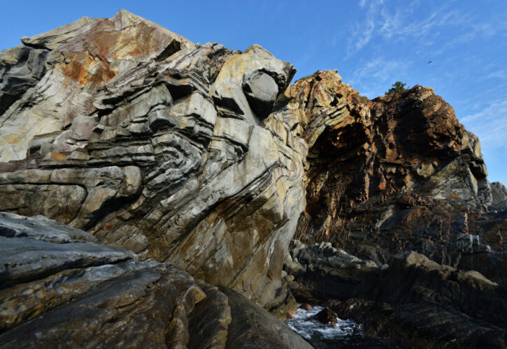 Phoenix Fold (Nanki Kumano Geopark / Wakayama Prefecture). Layers of rock that were originally horizontal, were folded on top of each other due to the huge force of the Earth's moving plates. 